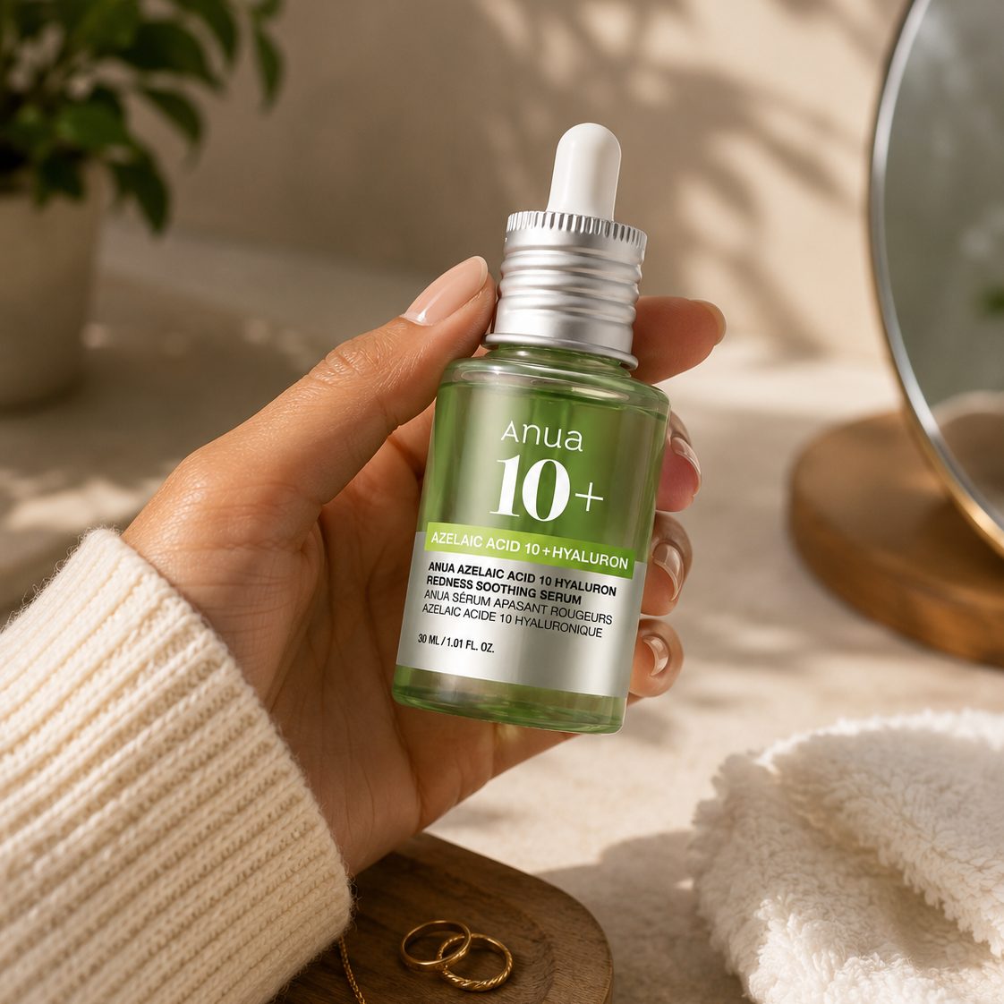The serum bottle held in one hand