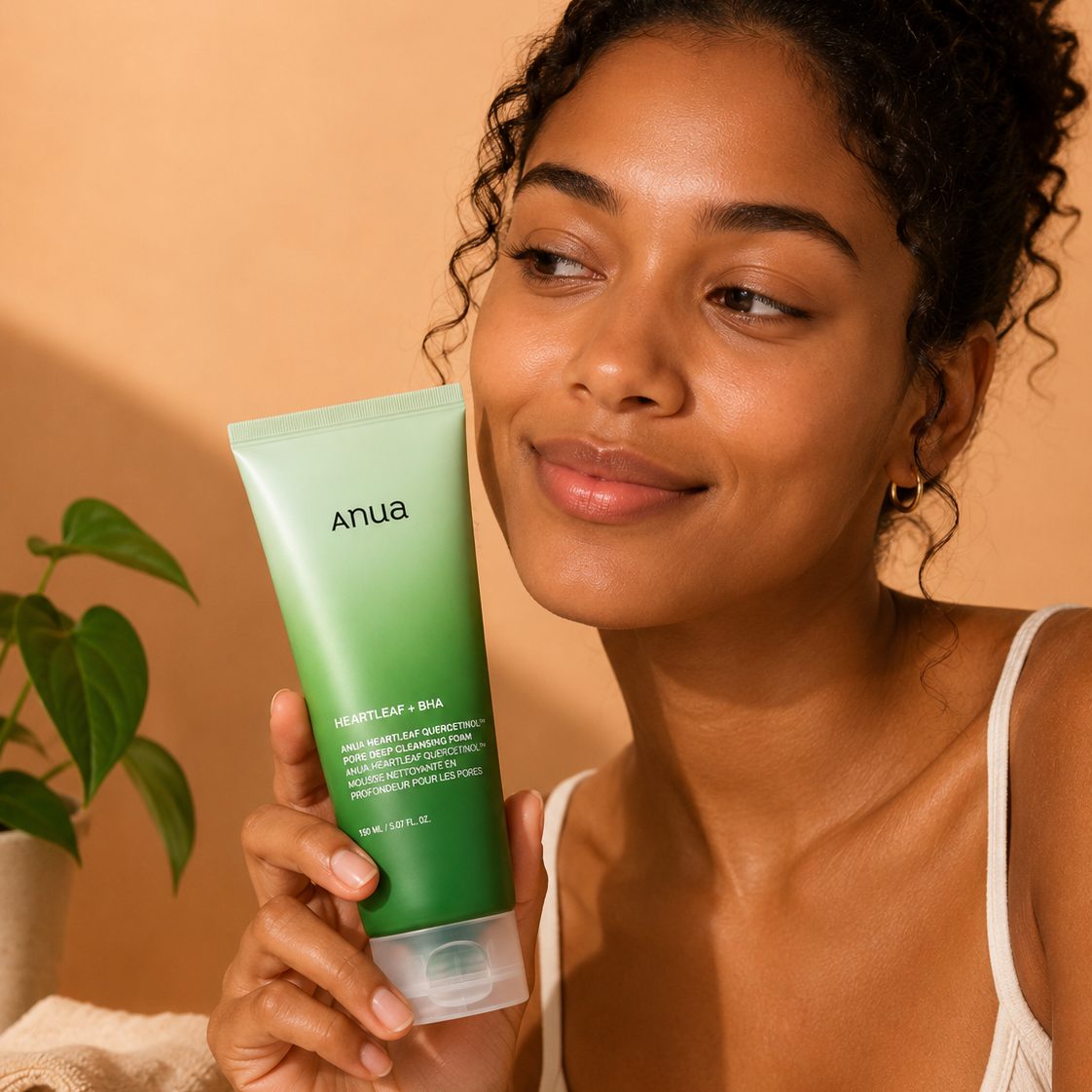 A model holding the cleansing foam