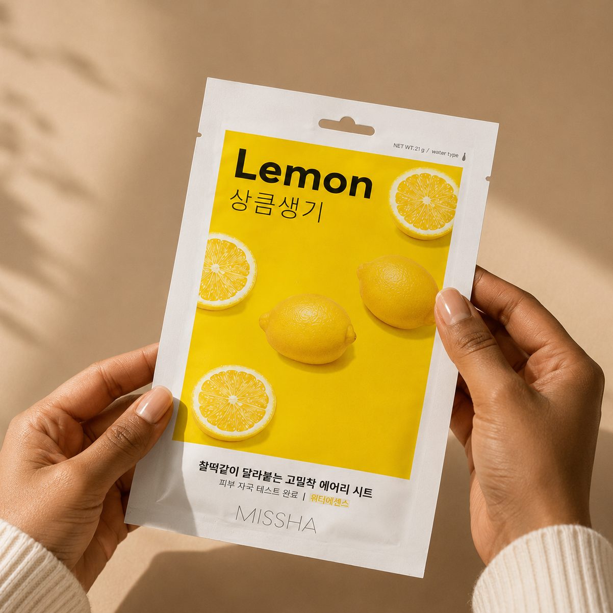 The Lemon sachet held in both hands